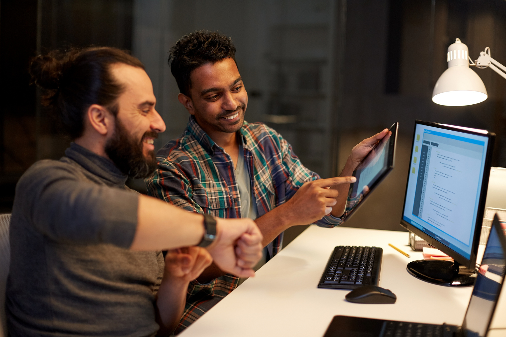 Creative Team with Tablet Pc Working at Office